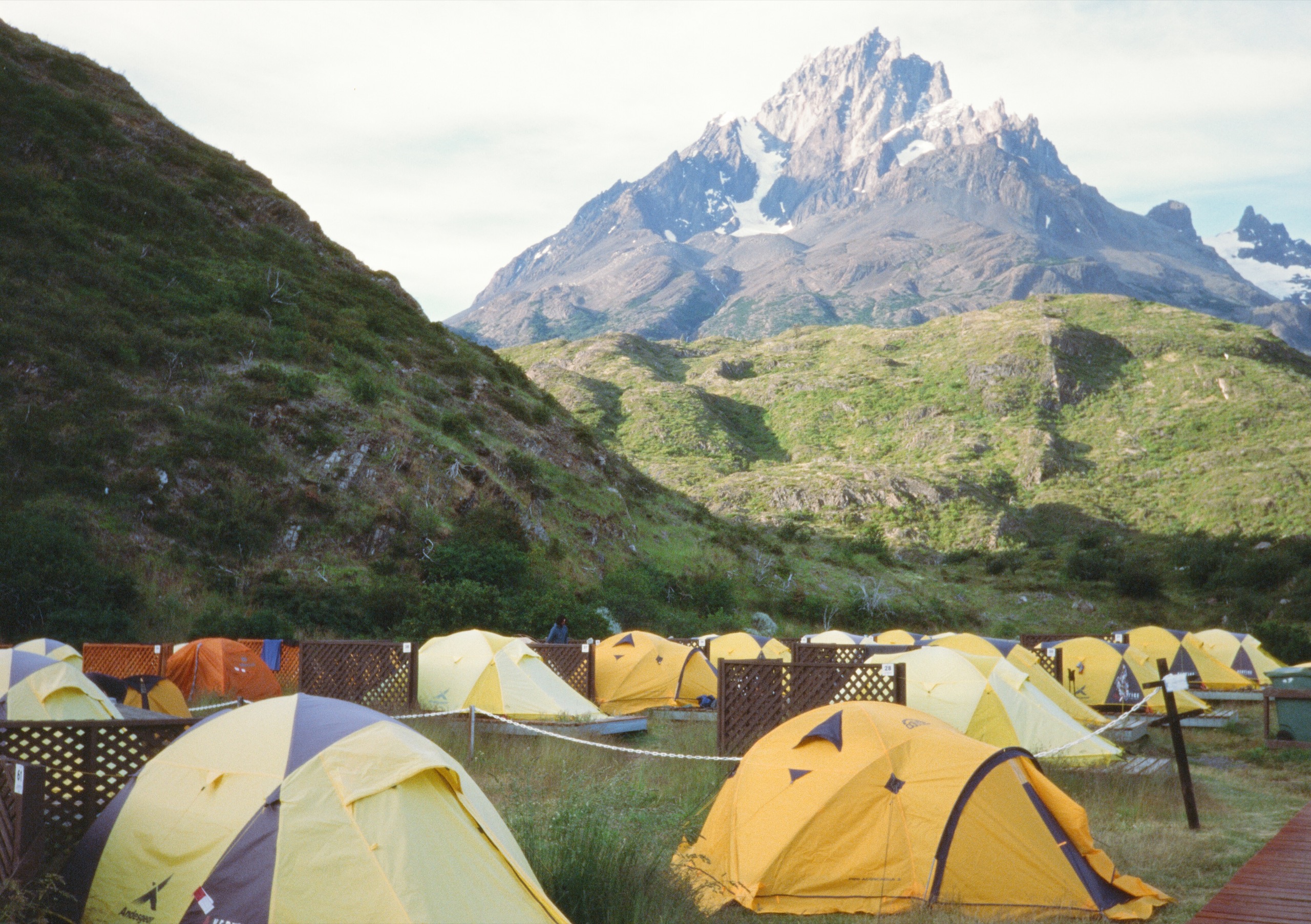 Yellow tents beneath a mountain in Patagonia