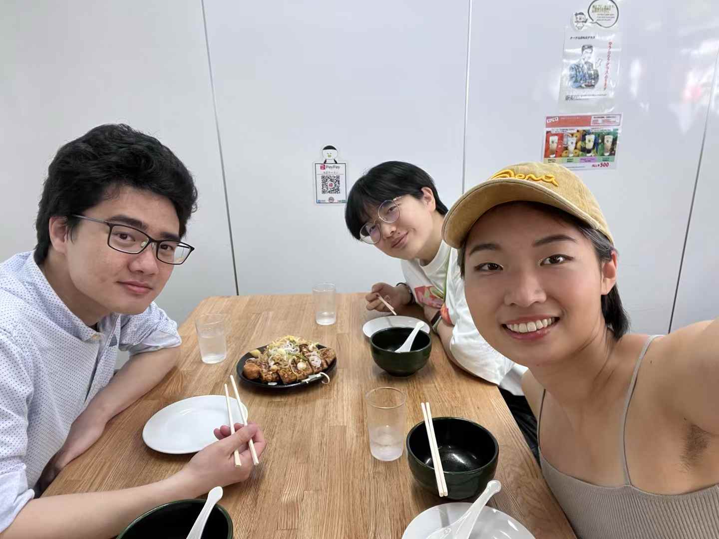 Fuma sharing a meal with friends in Tokyo